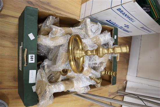 A large quantity of mixed brass candlesticks